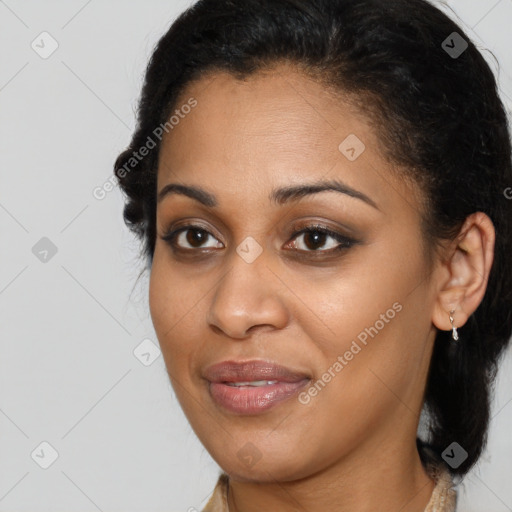 Joyful latino young-adult female with medium  brown hair and brown eyes