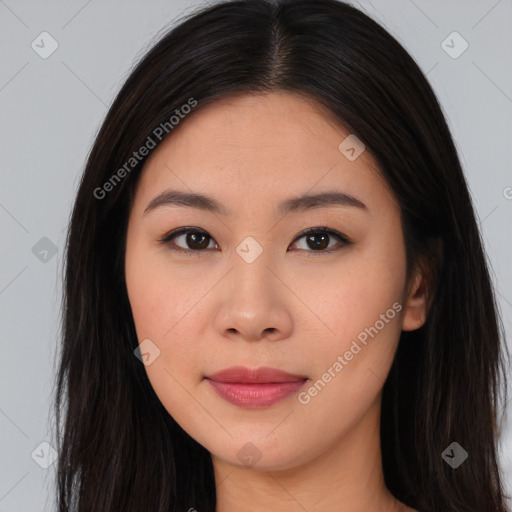 Joyful asian young-adult female with long  brown hair and brown eyes