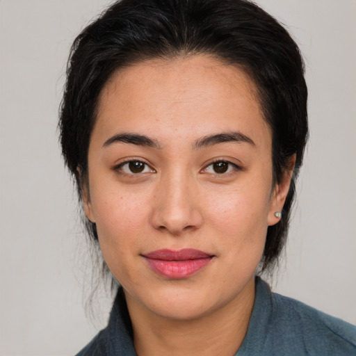 Joyful asian young-adult female with medium  brown hair and brown eyes