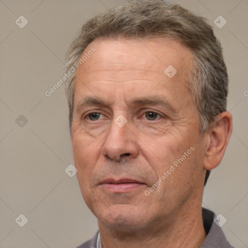 Joyful white middle-aged male with short  brown hair and brown eyes