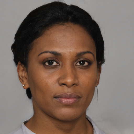 Neutral black young-adult female with short  black hair and brown eyes