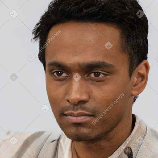 Neutral latino young-adult male with short  black hair and brown eyes