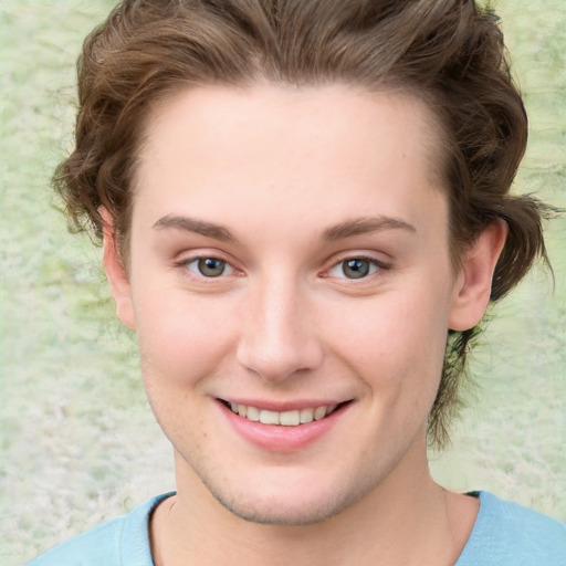 Joyful white young-adult female with short  brown hair and green eyes