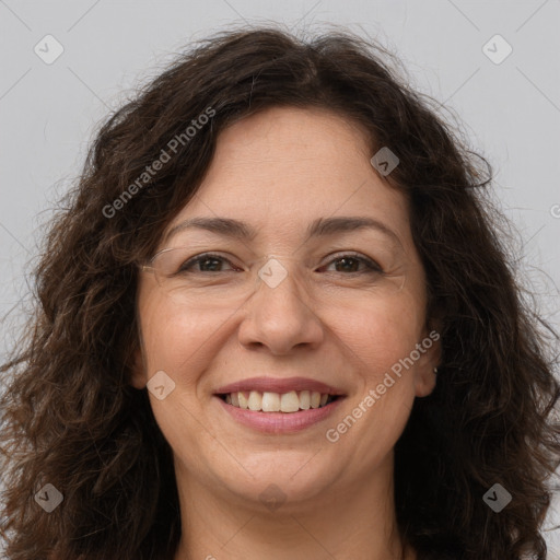 Joyful white adult female with long  brown hair and brown eyes