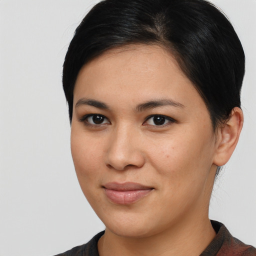 Joyful latino young-adult female with medium  brown hair and brown eyes