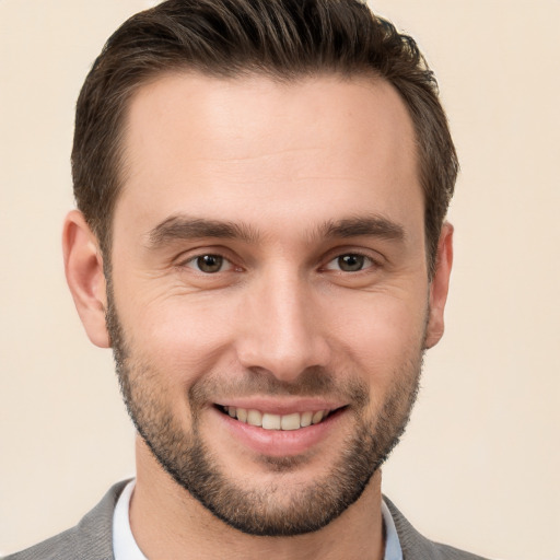 Joyful white young-adult male with short  brown hair and brown eyes