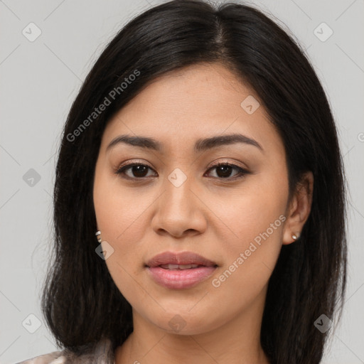 Joyful asian young-adult female with long  brown hair and brown eyes