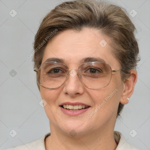 Joyful white adult female with short  brown hair and brown eyes