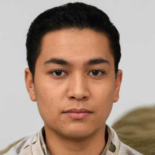Neutral latino young-adult male with short  brown hair and brown eyes