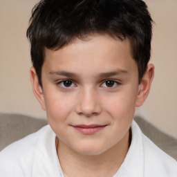 Joyful white child male with short  brown hair and brown eyes