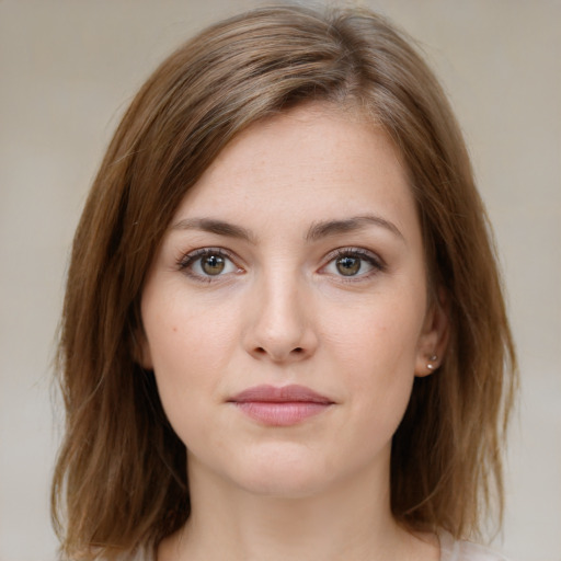 Neutral white young-adult female with medium  brown hair and green eyes