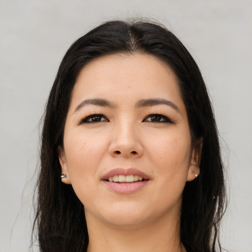Joyful asian young-adult female with long  brown hair and brown eyes