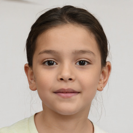 Joyful white child female with short  brown hair and brown eyes