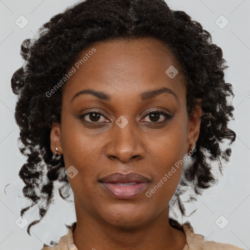 Joyful black adult female with medium  brown hair and brown eyes