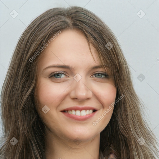 Joyful white young-adult female with long  brown hair and blue eyes