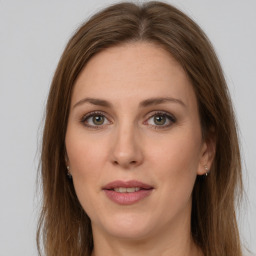 Joyful white young-adult female with long  brown hair and green eyes