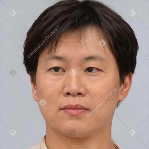 Neutral asian adult male with short  brown hair and brown eyes