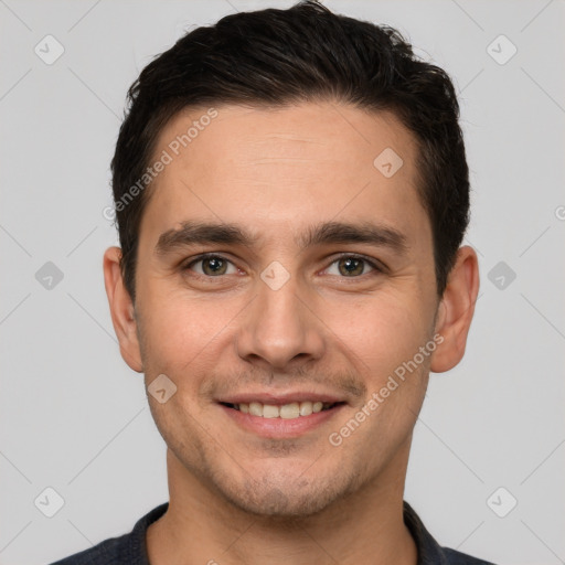 Joyful white young-adult male with short  brown hair and brown eyes