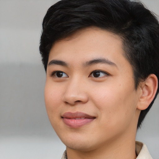 Joyful asian young-adult female with medium  black hair and brown eyes