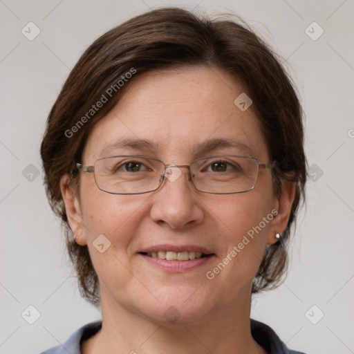 Joyful white adult female with medium  brown hair and grey eyes