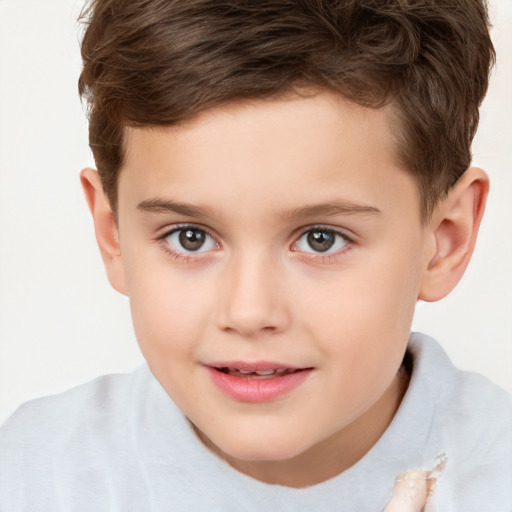 Joyful white child male with short  brown hair and brown eyes