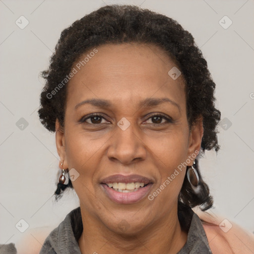 Joyful black adult female with short  brown hair and brown eyes