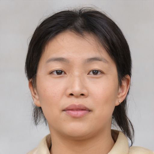 Neutral asian young-adult female with medium  brown hair and brown eyes