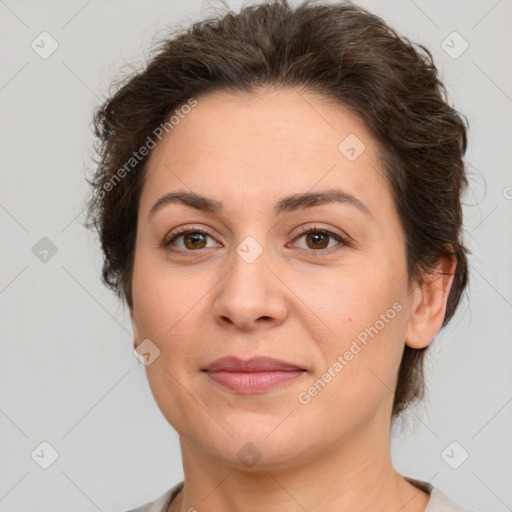 Joyful white adult female with short  brown hair and brown eyes