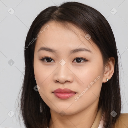 Joyful asian young-adult female with long  brown hair and brown eyes