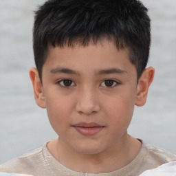 Joyful white child male with short  brown hair and brown eyes