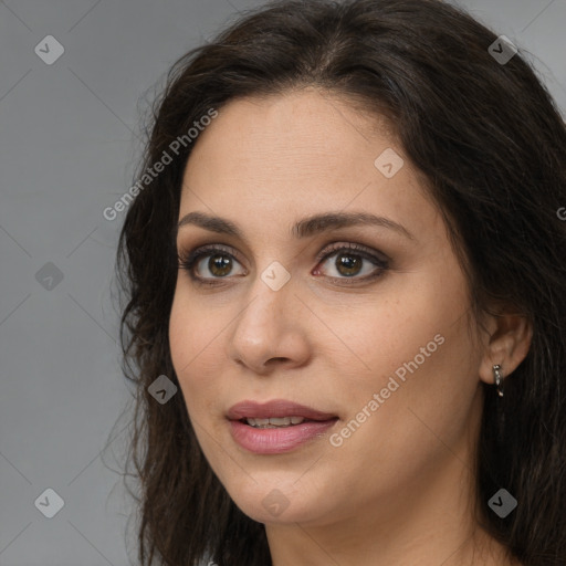 Joyful white young-adult female with long  brown hair and brown eyes