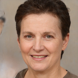 Joyful white adult female with short  brown hair and brown eyes