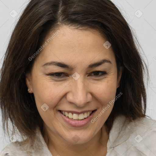 Joyful white adult female with medium  brown hair and brown eyes