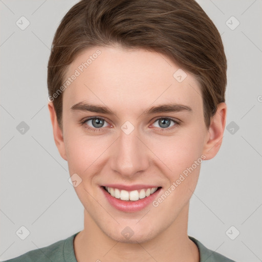 Joyful white young-adult female with short  brown hair and grey eyes