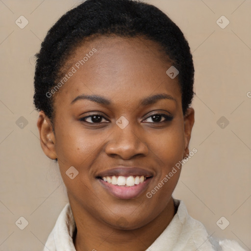 Joyful black young-adult female with short  brown hair and brown eyes