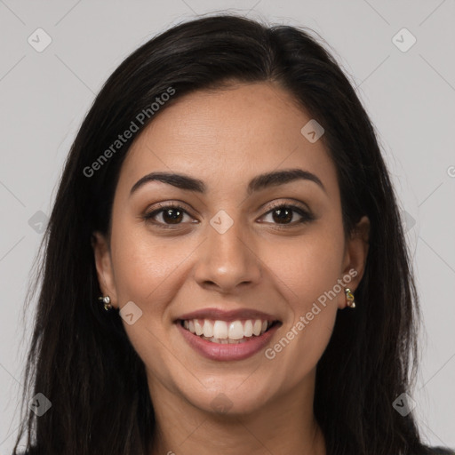 Joyful latino young-adult female with long  brown hair and brown eyes