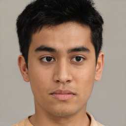 Neutral asian young-adult male with short  brown hair and brown eyes