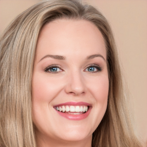 Joyful white young-adult female with long  brown hair and blue eyes