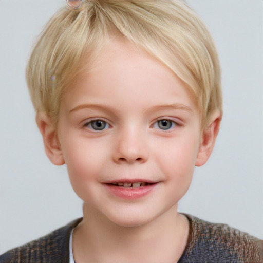 Joyful white child female with short  brown hair and blue eyes