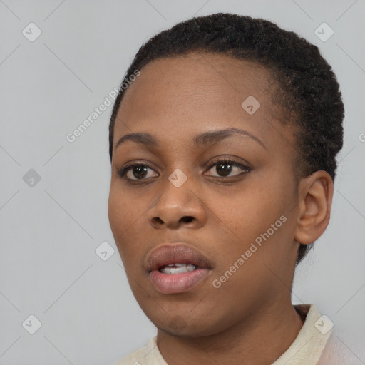 Neutral black young-adult female with short  black hair and brown eyes