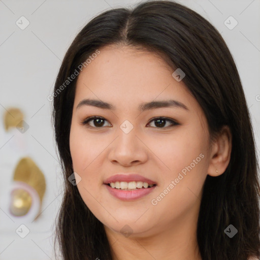 Joyful latino young-adult female with long  brown hair and brown eyes