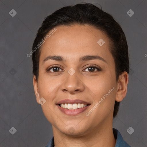 Joyful white young-adult female with short  brown hair and brown eyes