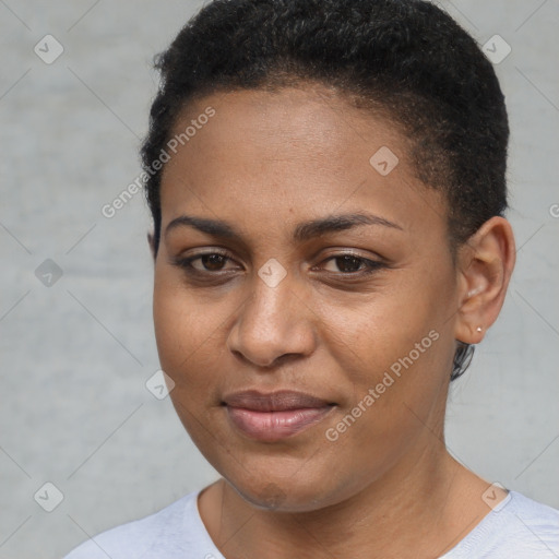 Joyful black young-adult female with short  brown hair and brown eyes