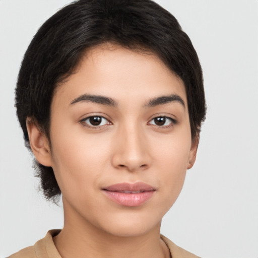 Joyful latino young-adult female with medium  brown hair and brown eyes