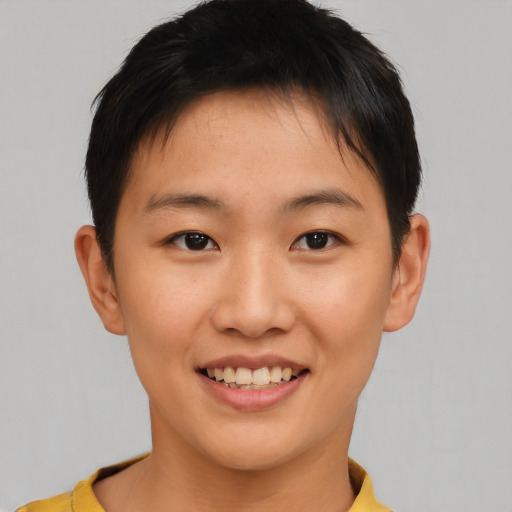 Joyful asian young-adult female with short  brown hair and brown eyes