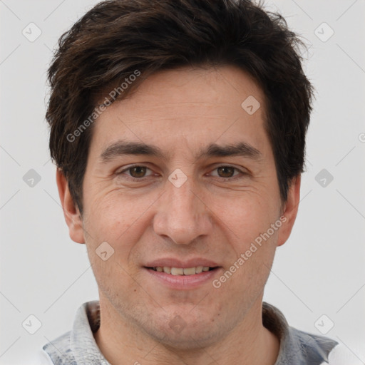 Joyful white adult male with short  brown hair and brown eyes