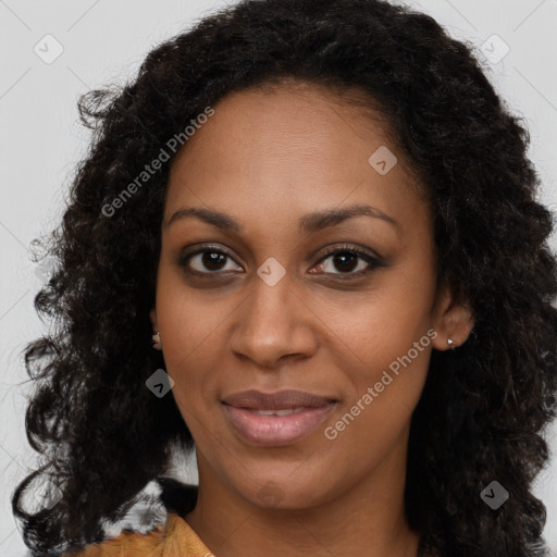 Joyful black young-adult female with long  brown hair and brown eyes