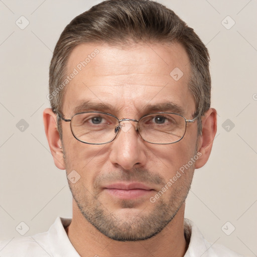 Joyful white adult male with short  brown hair and grey eyes