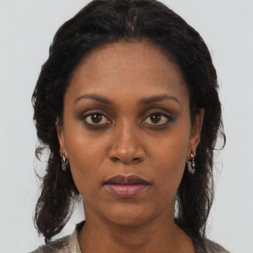 Neutral black young-adult female with medium  black hair and brown eyes