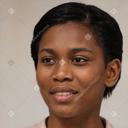 Joyful black young-adult female with short  black hair and brown eyes